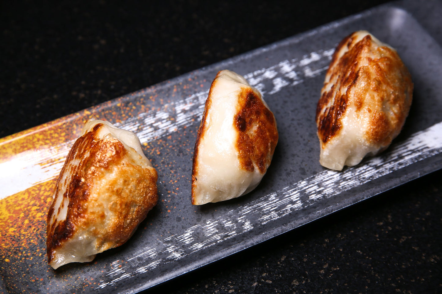 D13. Pan Fried Dumplings | 香煎锅贴